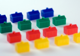 rows of plastic monopoly houses