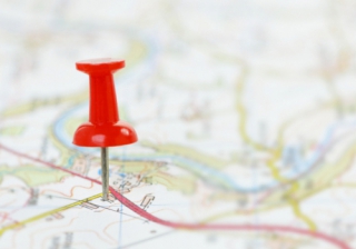 red pin in paper map