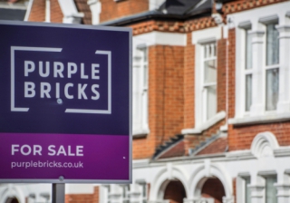 purplebricks estate agency sign outside house
