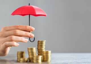 money covered by tiny umbrella