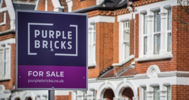 purplebricks estate agency sign outside house