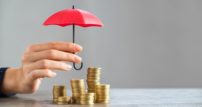 money covered by tiny umbrella
